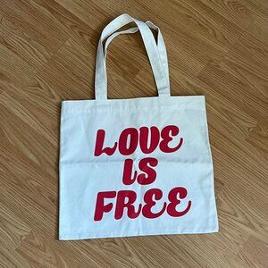 ❤️ “LOVE IS FREE” White tote bag with red lettering! ❤️